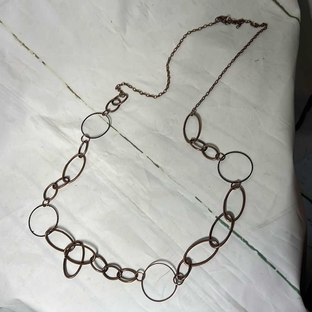 Long brass color necklace